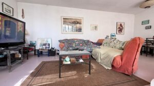 Spacious duplex for renovation in Sol de Mallorca featuring bright interiors, private rooftop terrace, communal pool, large garage, and prime location near beaches, golf courses, international schools, and luxury marinas.