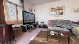 Spacious duplex for renovation in Sol de Mallorca featuring bright interiors, private rooftop terrace, communal pool, large garage, and prime location near beaches, golf courses, international schools, and luxury marinas.